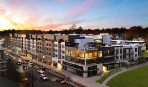 This is a great aerial drown photo showing the scale of this mixed use development. You can also see the upper floors of the precast parking garage behind the podium slab and residential apartment framing. You can also see the houses that face the new Dresden luxury townhouses.